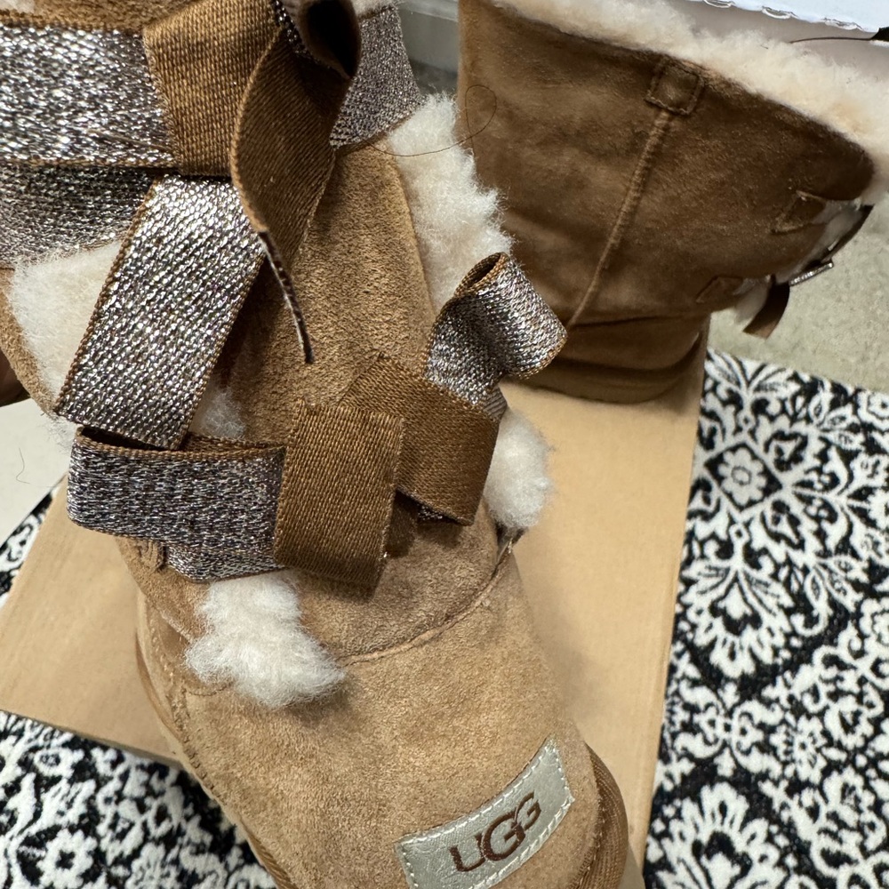 UGG Tan Sheepskin Boots with Ribbon Accents
